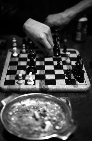 Chess game between two people you see an ashtray in the foregroundの写真素材