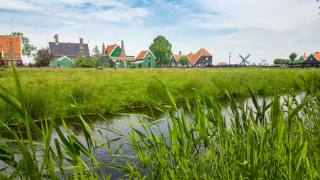 Typical Dutch landscape with houses and vegetationの写真素材