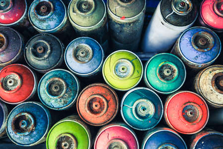 Spray cans photographed from above, you see all the colors usable.の写真素材