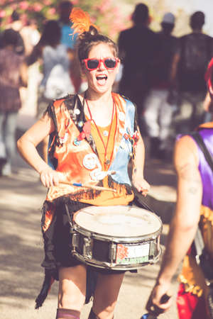 Ventimiglia, Italy, 14.07.2018: Girl playing the drums during a town festival of Ventimiglia in Liguriaのeditorial素材