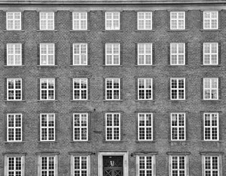 Panorama view of a typical orange house in Nyboder which is a historic row house district of former Naval barracks and was built by King Christian IVの写真素材