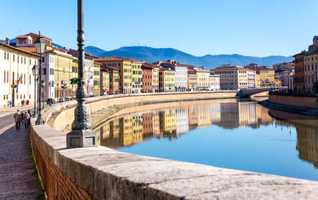 Pisa, Italy, 12/02/2018: Urban landscape of the city of Pisa crossed by the river Arno, photo taken during a holidayのeditorial素材
