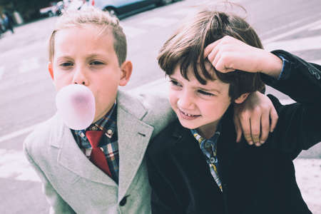 Imperia, Italy, 25/05/2019: Street photography of boys around the city of Imperia photographed while eating chewing gumのeditorial素材