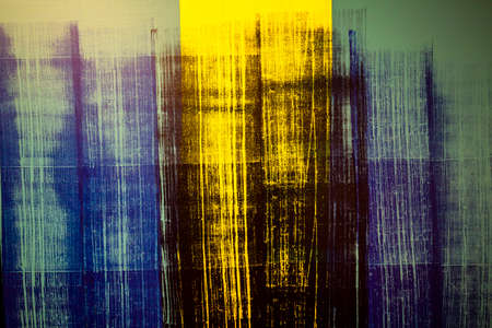 artistic background blue and yellow with black spots laid on the canvasの写真素材