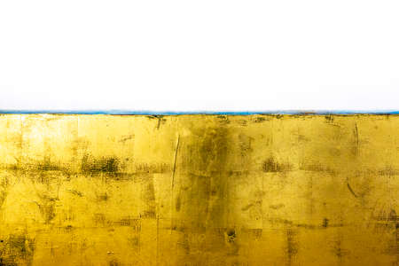 artistic background with canvas painted with gold paintの写真素材