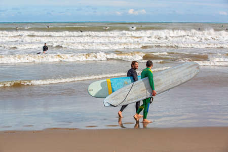 surfers by the sea in Liguriaのeditorial素材