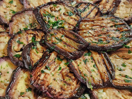 grilled and seasoned aubergines backgroundの写真素材