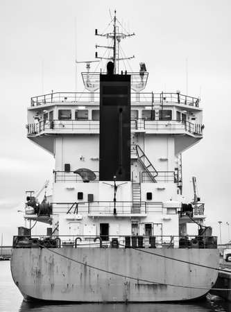 cargo ship moored Big ship in the commercial port of Imperia Onegliaの写真素材