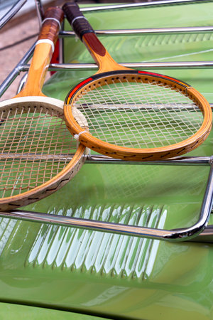Vintage Tennis Rackets on Classic Car Bonnet Retro Sports Gear Displayの写真素材