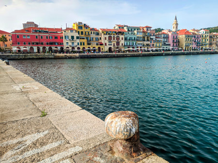 Imperia harbor with colorful buildings along the waterfront, clear sky, and calm sea, typical Ligurian coastal sceneryの写真素材