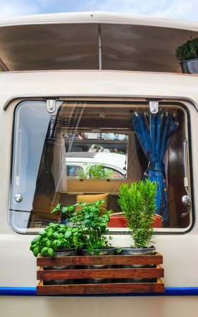 Vintage Camper with Herb Garden on Windowの写真素材