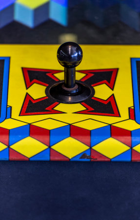 Vintage Arcade Joystick Front View with Bright Colorsの写真素材