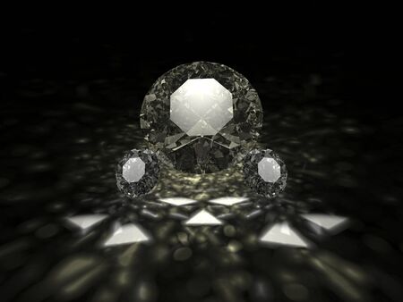 A three sparkling brilliant cut diamonds on dark backgroundの写真素材