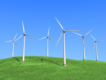 A white wind turbines against the skyの写真素材