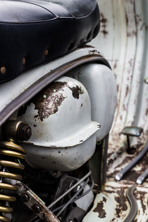 Close up of a rusty retro scooterの写真素材