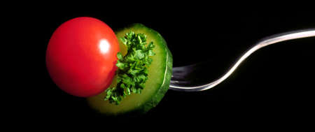 Tomato on forkの写真素材