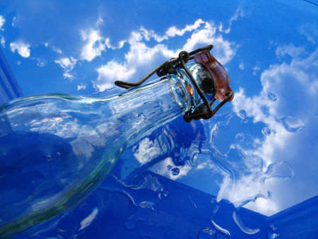 Glass bottle and waterの写真素材