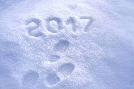 New Year 2017 greeting, footprints in snow, new year 2017, 2017 greeting cardの写真素材