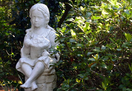 Statue of a little girl in a botanical garden,Floridaの写真素材
