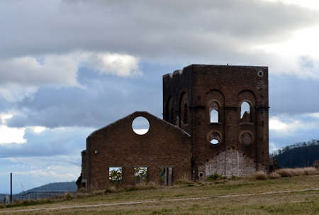 A view of the old blast furnace at Lithgow, Australia. This was used to make iron and steel in the early part of last century. It is now abandoned but remains as a feature near the Lake Pillans Wetlanのeditorial素材