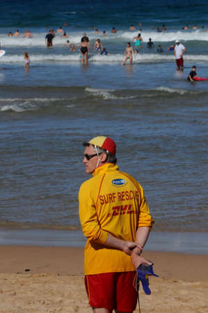 A life guard watches on Sydney's famous Manly Beach in Australiaのeditorial素材