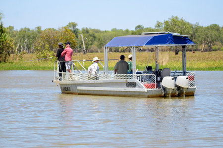 Tourists fishing for Barramundi in the Yellow Water Reserve at Kakadu in the Northern Territory of Australiaのeditorial素材