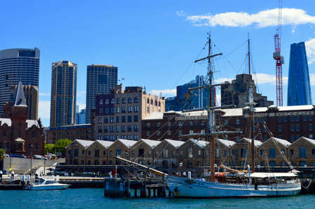 a large ship docked in a harbor next to a body of waterのeditorial素材