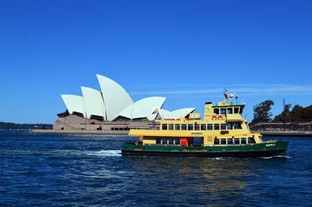 A ferry drifts past the Sydney Opera Houseのeditorial素材