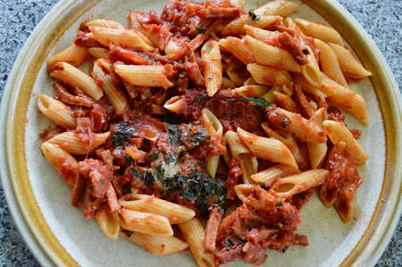 Pepperoni pasta served on a plateの写真素材