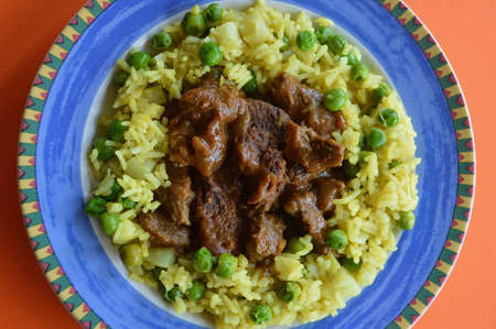 Beef Korma with basmati rice and vegetablesの写真素材