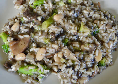 mushroom risotto with white beans and broccoliの写真素材