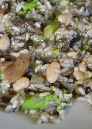 mushroom risotto with white beans and broccoliの写真素材