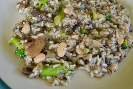 mushroom risotto with white beans and broccoliの写真素材