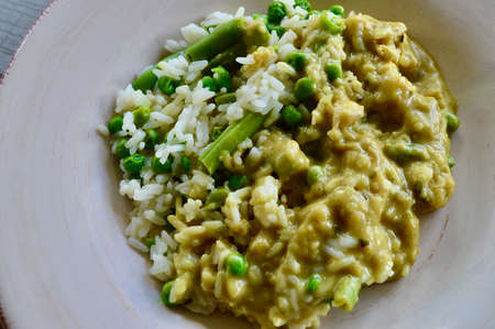 Thai green chicken curry with rice and vegetablesの写真素材