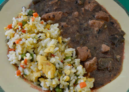 Black bean chicken and egg fried riceの写真素材