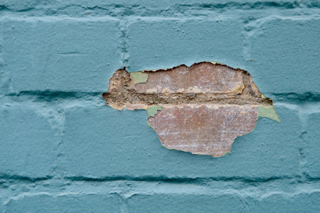 Old brick wall with peeling paint. Abstract background for design.の写真素材