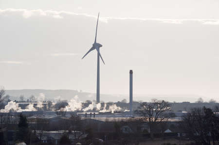 Giant wind turbine in an urban/industrial settingの写真素材