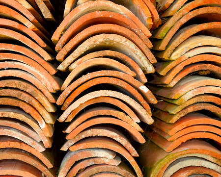 Stacks of red terracotta roof tiles.の写真素材