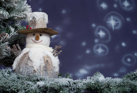 Snowman next to Christmas treeの写真素材
