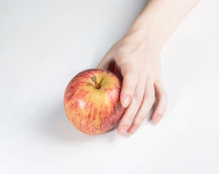 hand holding appleの写真素材