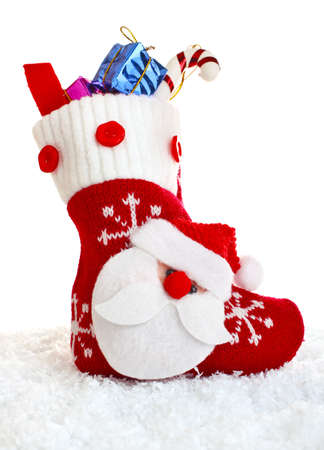 christmas sock with present isolated on white backgroundの写真素材