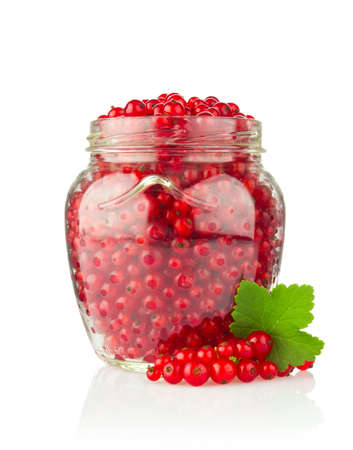 Fresh Red Currant with Green Leaf in glass jar Isolated on White Backgroundの写真素材