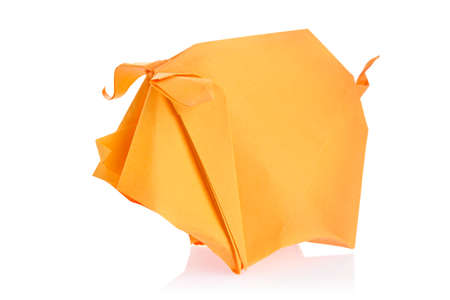 Orange pig of origami, isolated on white background.の写真素材
