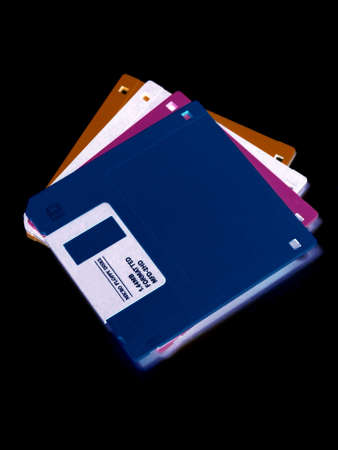 portrait of colorful floppydiscs on black backgroundの写真素材