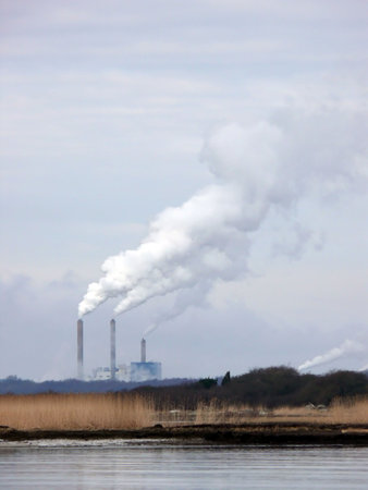 portrait of industry chimney smoke in nature skyの写真素材