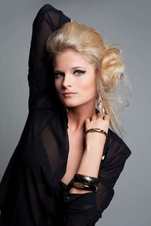 Beautiful woman with evening make-up. Jewelry and Beauty. Isolated on white background.の写真素材