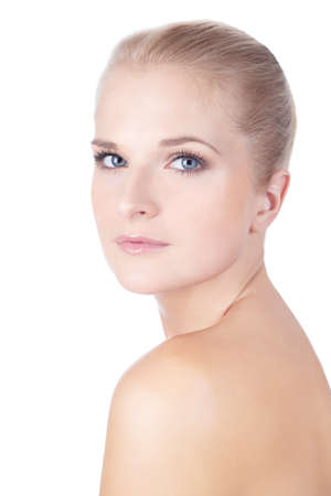 Closeup face of fashion model posing at studio. Looking at camera.  Isolated on white background.の写真素材