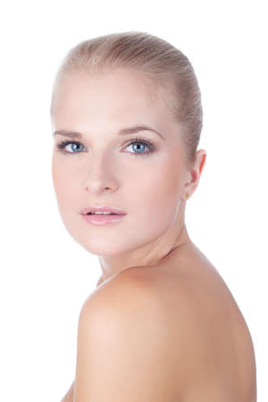 Closeup face of fashion model posing at studio. Looking at camera.  Isolated on white background.の写真素材