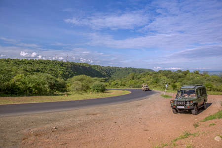 Safari transport on the road of Serengeti area, Tanzania, Africaの写真素材