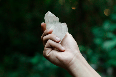 Hands holding crystal. Concept of occult symbolism and spiritual practice.の写真素材